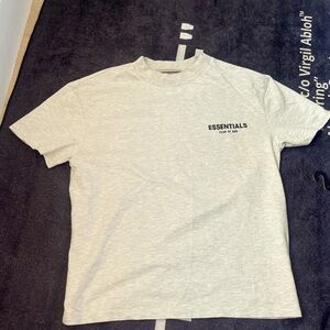 Im selling an essentials never worn t shirt